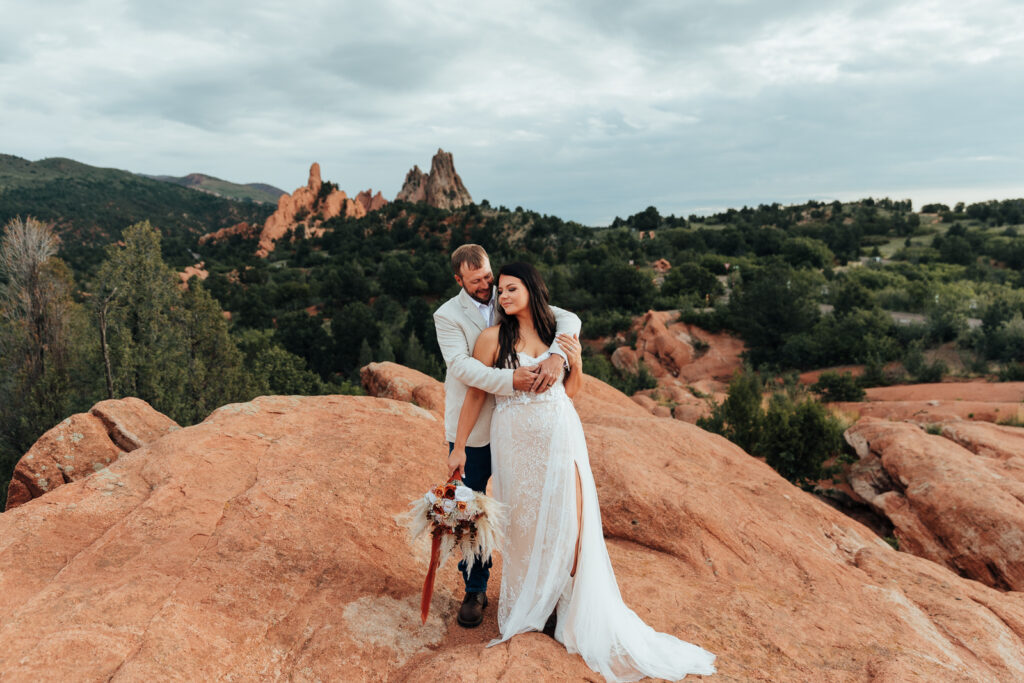 A couple hugging at High Point Overlook in Garden of the Gods, Colorado Springs 