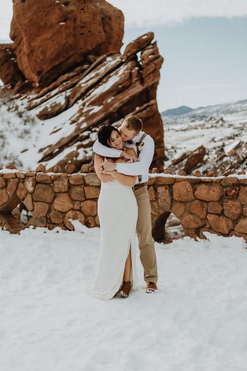 Couple hugging at their elopement at Red Rocks Amphitheater near Denver