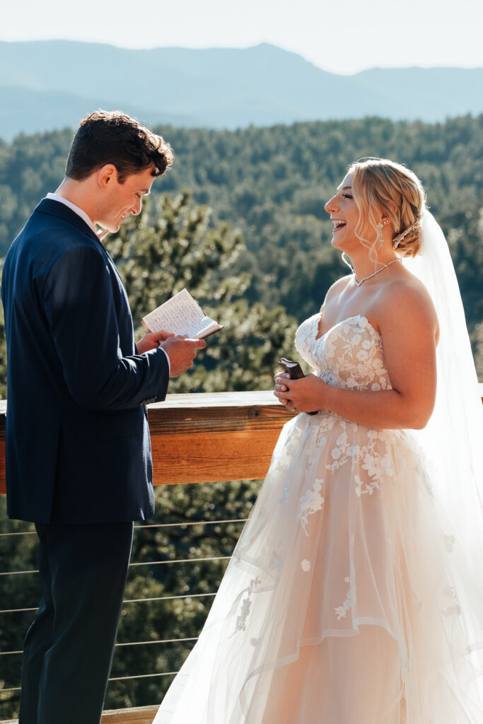 Couple exchanging vows at their airbnb elopement in Bailey, Colorado
