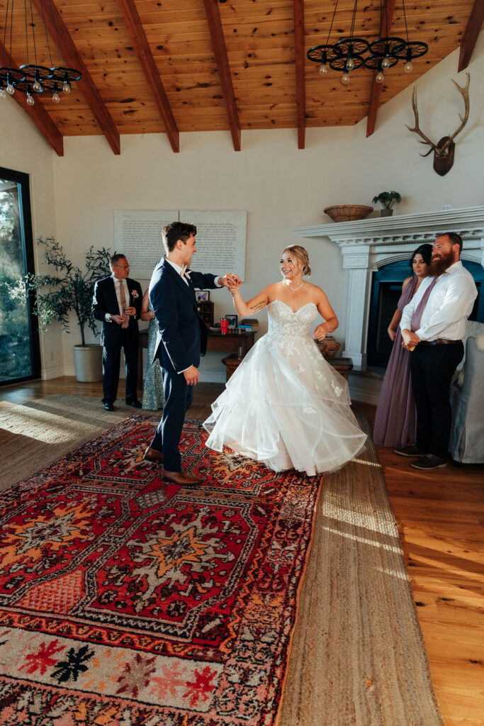 Couple sharing their first dance at their Airbnb elopement in Bailey, Colorado
