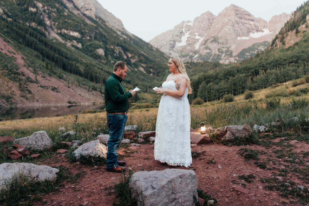 A couple exchanging vows at Maroon Bells in Aspen