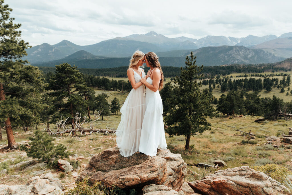 Couple standing forehead to forehead at 3M Curve, Rocky Mountain National Park in Estes Park 