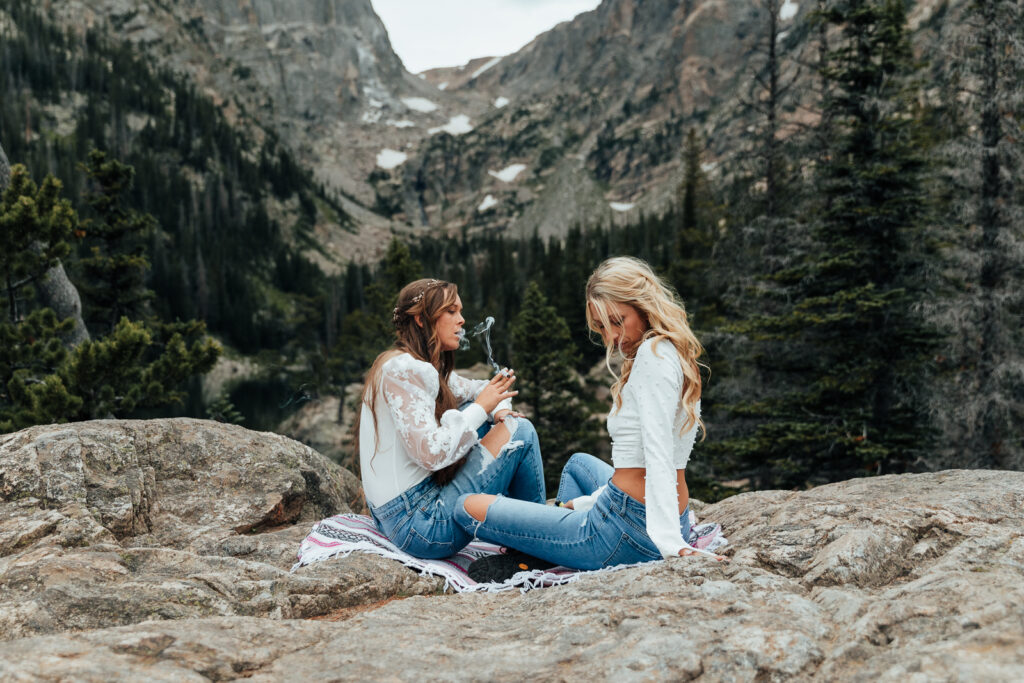 A couple sharing a unity joint at Dream Lake, Rocky Mountain National Park in Estes Park 