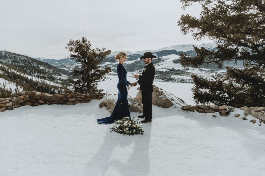 A couple exchanging vows at Sapphire Point Overlook near Breckenridge, Colorado