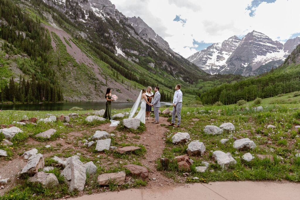 A couple exchanging vows at Maroon Bells in Aspen, Colorado