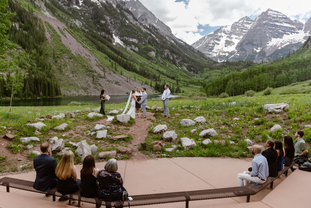 A couple exchanging vows at Maroon Bells in Aspen, Colorado