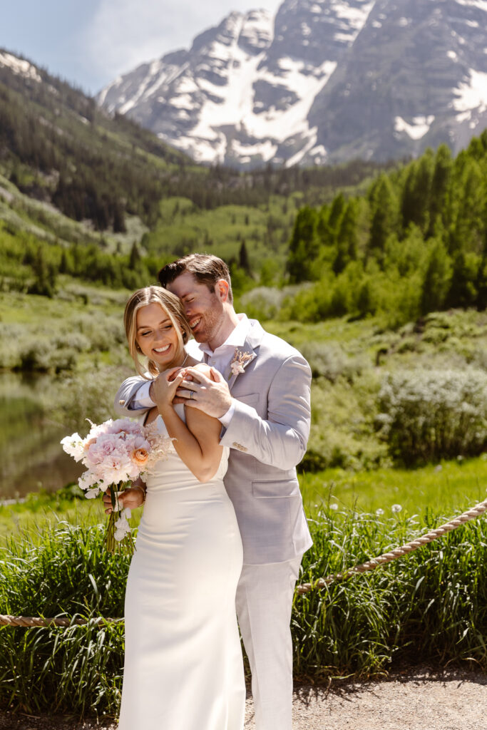 A bride and groom at their elopement at Maroon Bells in Aspen, Colorado