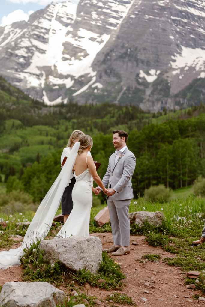 A couple exchanging vows at Maroon Bells in Aspen, Colorado