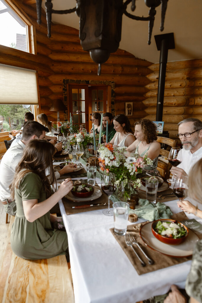 A couple sharing a meal with their family on their elopement day. 