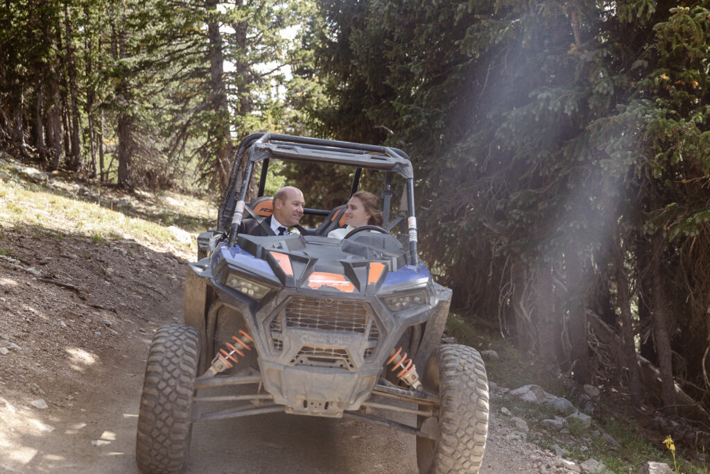 A couple riding an ATV on their elopement in Breckenridge, Colorado. 