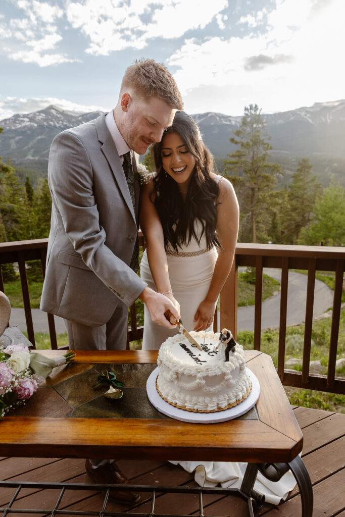 Couple cutting their cake at their airbnb in Breckenridge, Colorado. 